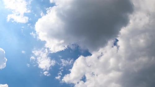 Lovely little white clouds turning into a grey cloudscape.