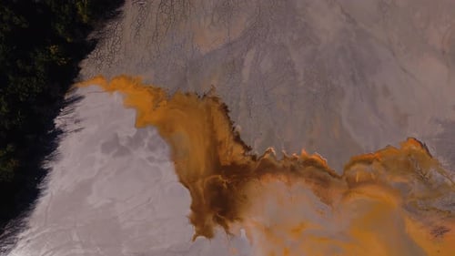 Aerial View of Cracked Earth with Polluted Water