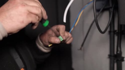Close Up of Electrician Repairing Electrical Wires
