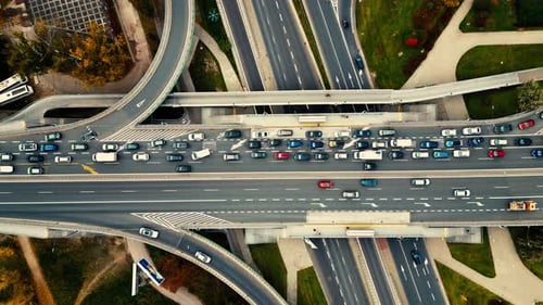 Aerial shot of elevated road junction. Drone footage of top view of Highway road junctions. The Inte