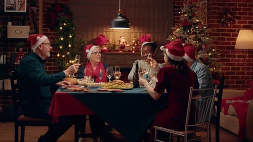 Adults Toasting at Christmas Family Dinner