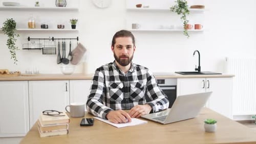 Cheerful Man Working From Home Gives Thumbs Up