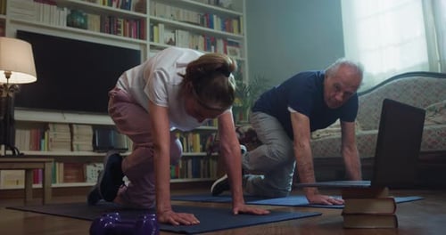 Senior Couple Exercising Together at Home
