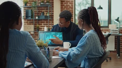 Team Collaborating on Data Analysis in Modern Office