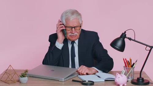 Angry Senior Business Man Making Phone Call at Office Work Annoyed Boss Talking Mobile Quarrel