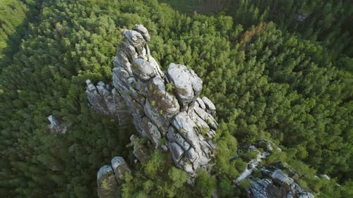 Top down view of Bastei towering rock formations surrounded by dense forest in Elbe Sandstone Mounta