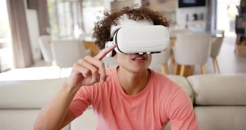 Young Adult Using Virtual Reality Headset at Home
