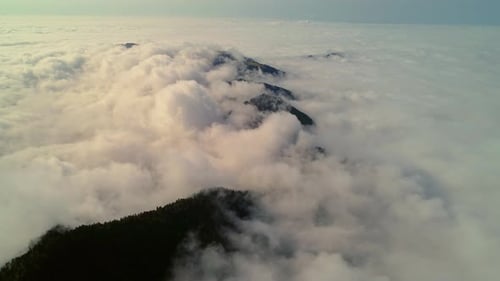 Clouds Creeping Over The Mountain Plateau