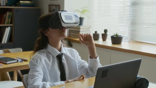 Young Adult Using Virtual Reality Headset in Classroom