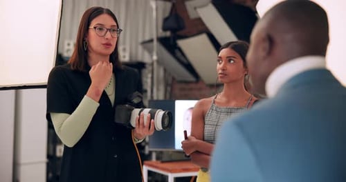 Photography, woman and talking to model in studio with photoshoot planning, strategy and technique