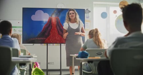 Geology Class Female Teacher Teaching Primary School Children Using Digital Screen