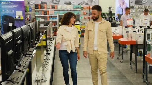Couple Choosing Tv Monitor in Electronics Store on Black Friday