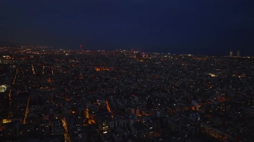 Aerial Panoramic Night View of Large City Streets and Buildings Under Dark Blue Sky Barcelona Spain