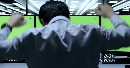 Close Up of Male Programmer Celebrating Succeed Working On Green Screen Desktops In The Server Room