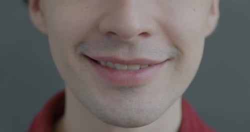 Smiling Young Man's Face in Extreme Close Up