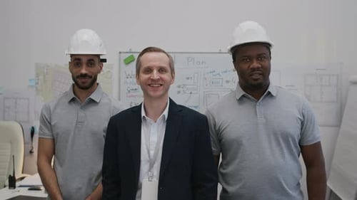 Team of Diverse Engineers Working in Construction Office, Portrait