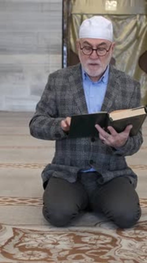 Man Reading Book Inside Mosque