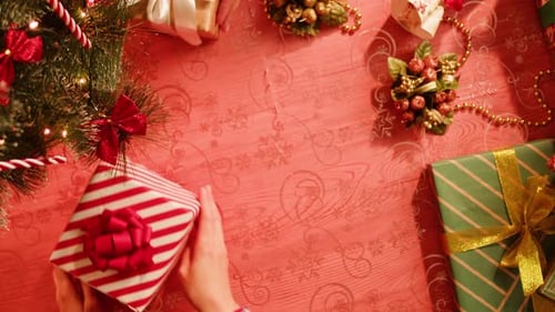 Friends Giving Presents to Each Other Top View Celebrating New Year Sitting at Dining Table