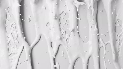 White flows of milk with splashes and liquid texture.