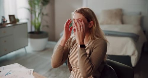 Woman, home and stress with documents or studying for school project as university student