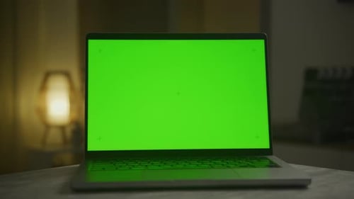 Laptop with Green Screen at Night