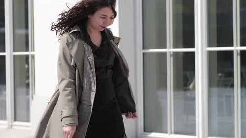 Stylish Woman Walking and Smiling in City