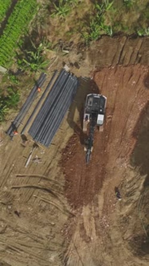 Vertical Video Concrete Pouring Begins for the Foundation of a Residential Complex with Skilled