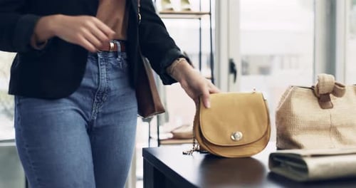 Woman, shopping and choice in handbag boutique, fashion and commerce with purse in discount store