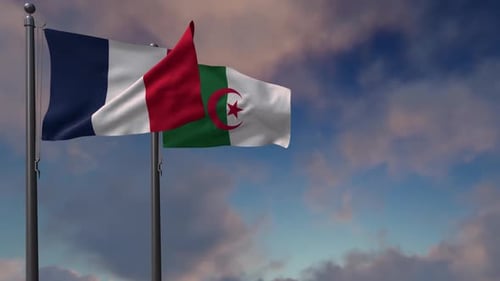 Waving Flags of France and Algeria Against Blue Sky