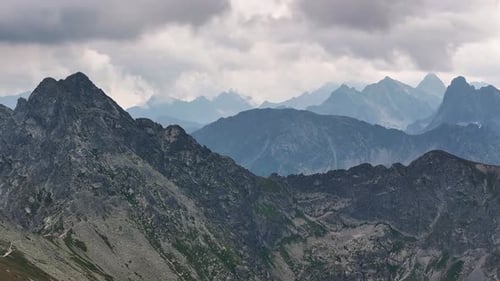 Majestic mountain ranges reveal hidden beauty at dawn in distant landscapes