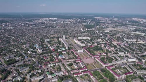 Shooting From a Quadcopter of City Blocks with Infrastructure and Industrial Areas on a Summer Day