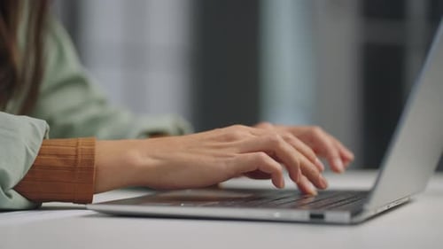 Woman Typing on Silver Laptop Keyboard Close-Up