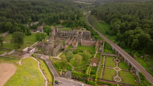 Aerial Views Reveal the Breathtaking Ruins of Villers Abbey Surrounded By Vibrant Gardens and Framed