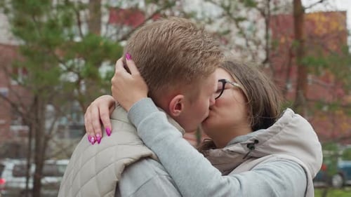 Romantic Couple Kissing in an Urban Setting
