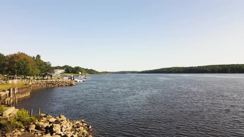 Aerial drone shot of drone pulling back to reveal the Pinance Virginia on the Kennebec River