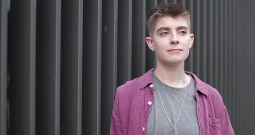 Young Adult Portrait Against Urban Wall