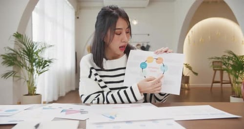 Young Woman Presenting Business Data Online