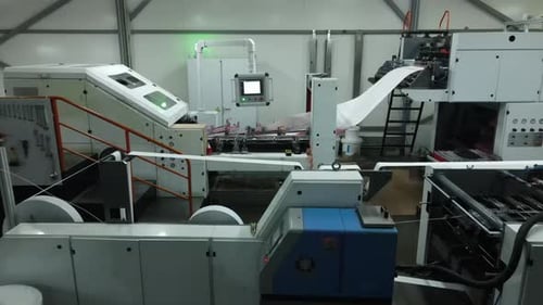 Automated Paper Processing Machine in Factory Industrial Printing Equipment in Operation Hightech