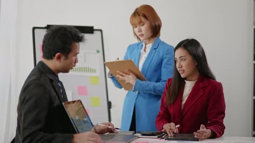 Team Meeting Analyzing Data in Workplace