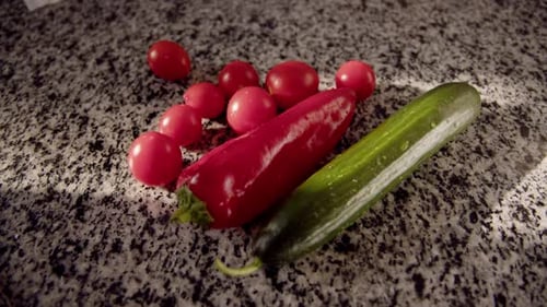 Fresh Cucumber, Pepper and Cherry Tomatoes on Counter