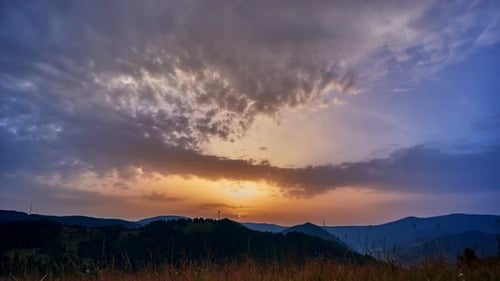 Sunrise Dense Clouds and Hilly Spring Rural Landscape