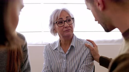 Group People Sitting in Circle Supporting Each Other at Community Center