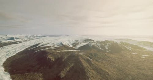 Stunning Aerial View of a Glacier and Rugged Terrain in a Remote Location