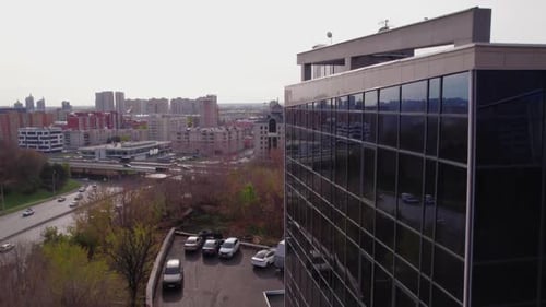 Office Building with Glass Facade Near Residential Buildings