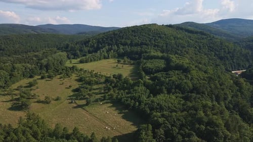 Aerial View of Countryside Area with Agricultural Fields Near Mountains