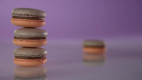 Stack of Macarons on a Purple Background