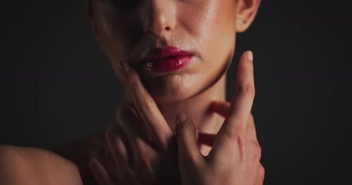 Close Up of Woman with Hands on Face