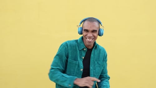 Man Listening to Music and Dancing Vigorously