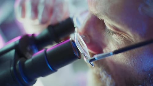 Scientist Using Microscope in Advanced Laboratory