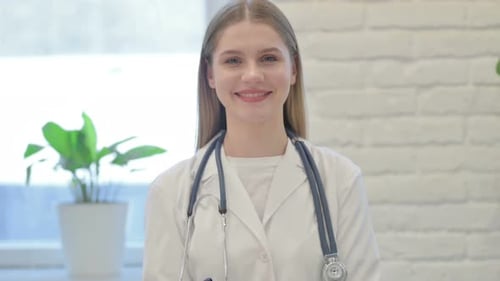 Young Doctor Smiling in Medical Setting